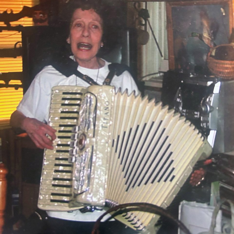 Woman playing accordion b